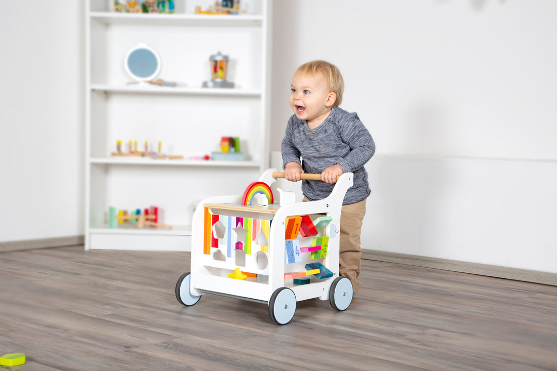 Lauflernwagen Regenbogen mit Kind von Spielspecht